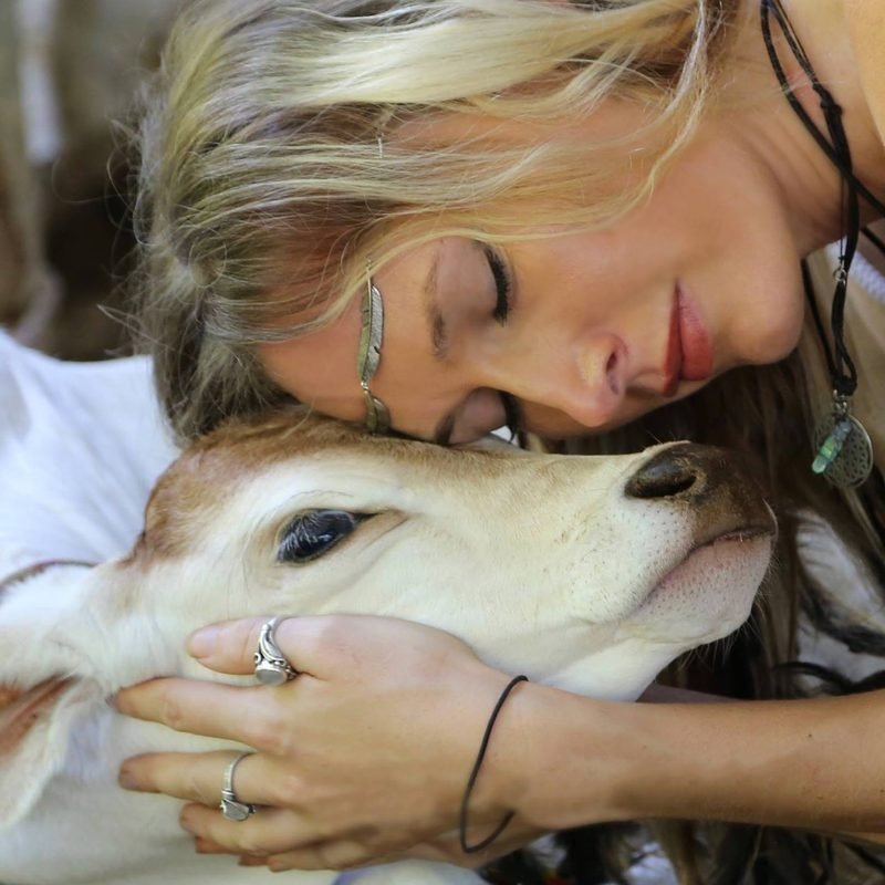 Heidi Little with a rescued calf — love, care and respect for all living things
